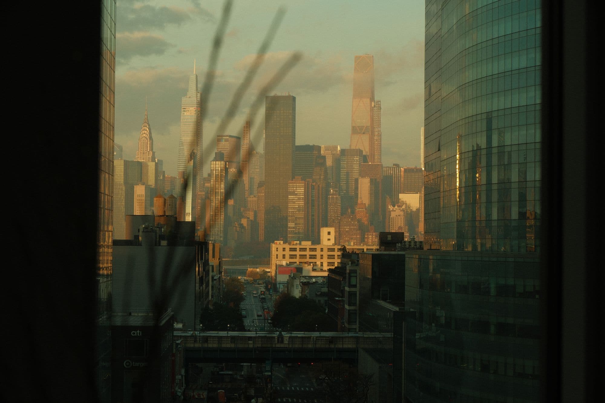 City skyline at golden hour seen from a high floor